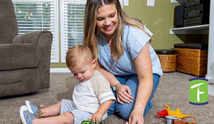 mom and baby playing inside room